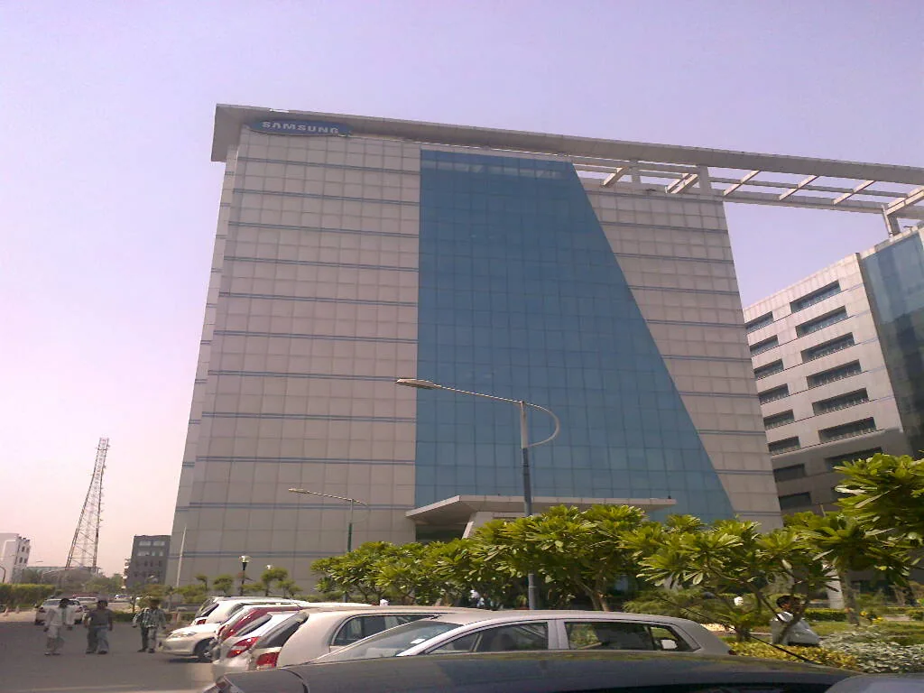 Glass office tower of the Logix Cyber Park IT campus in Noida