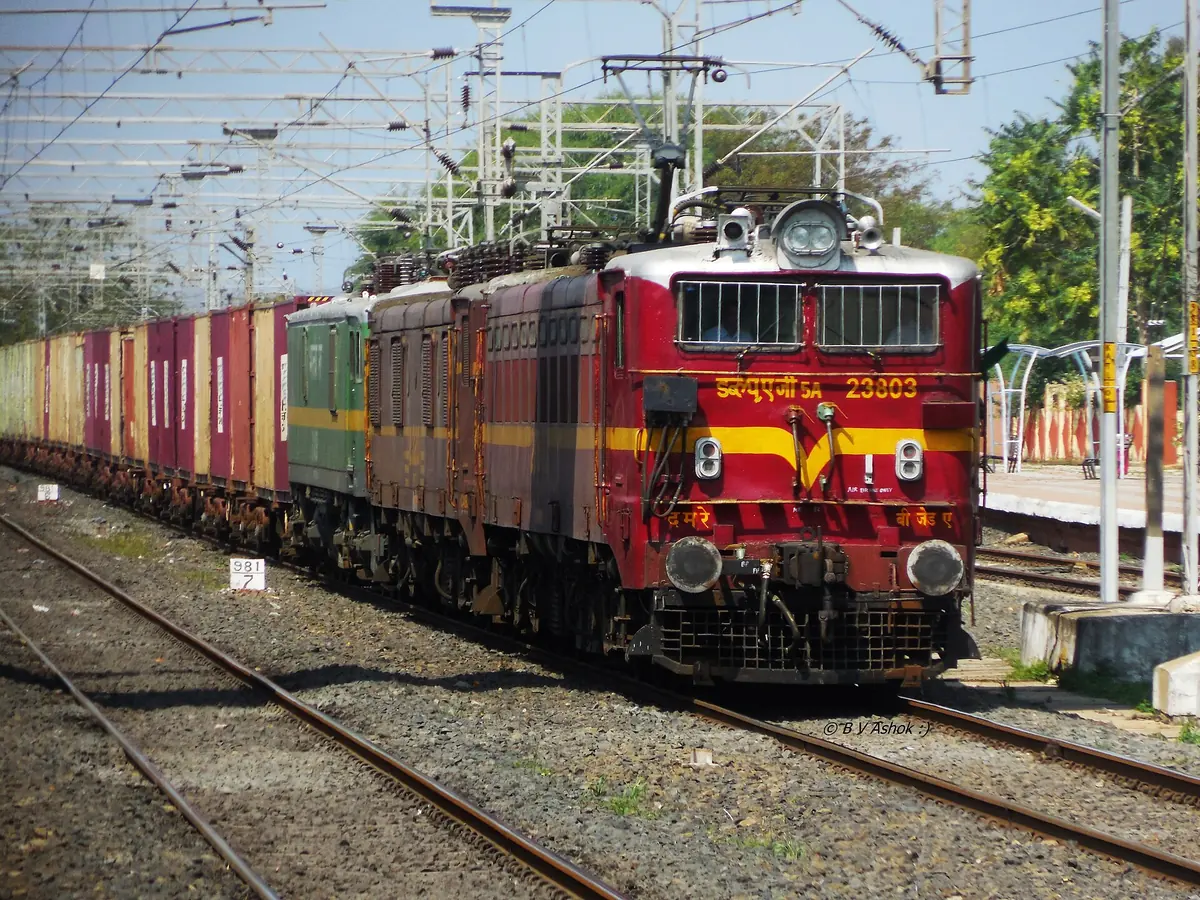Electric locomotive hauling a container freight train in India